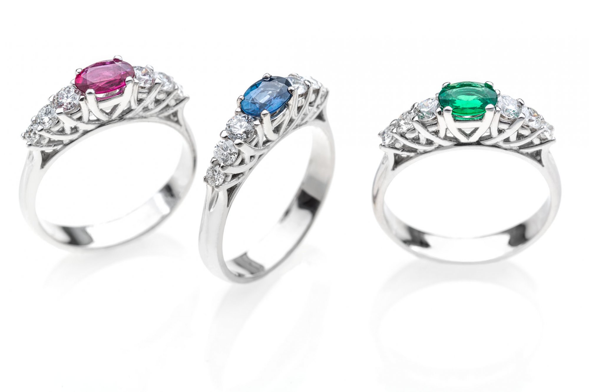 18 KT white gold rings with ruby,sapphire,emerald and round brilliant cut diamonds